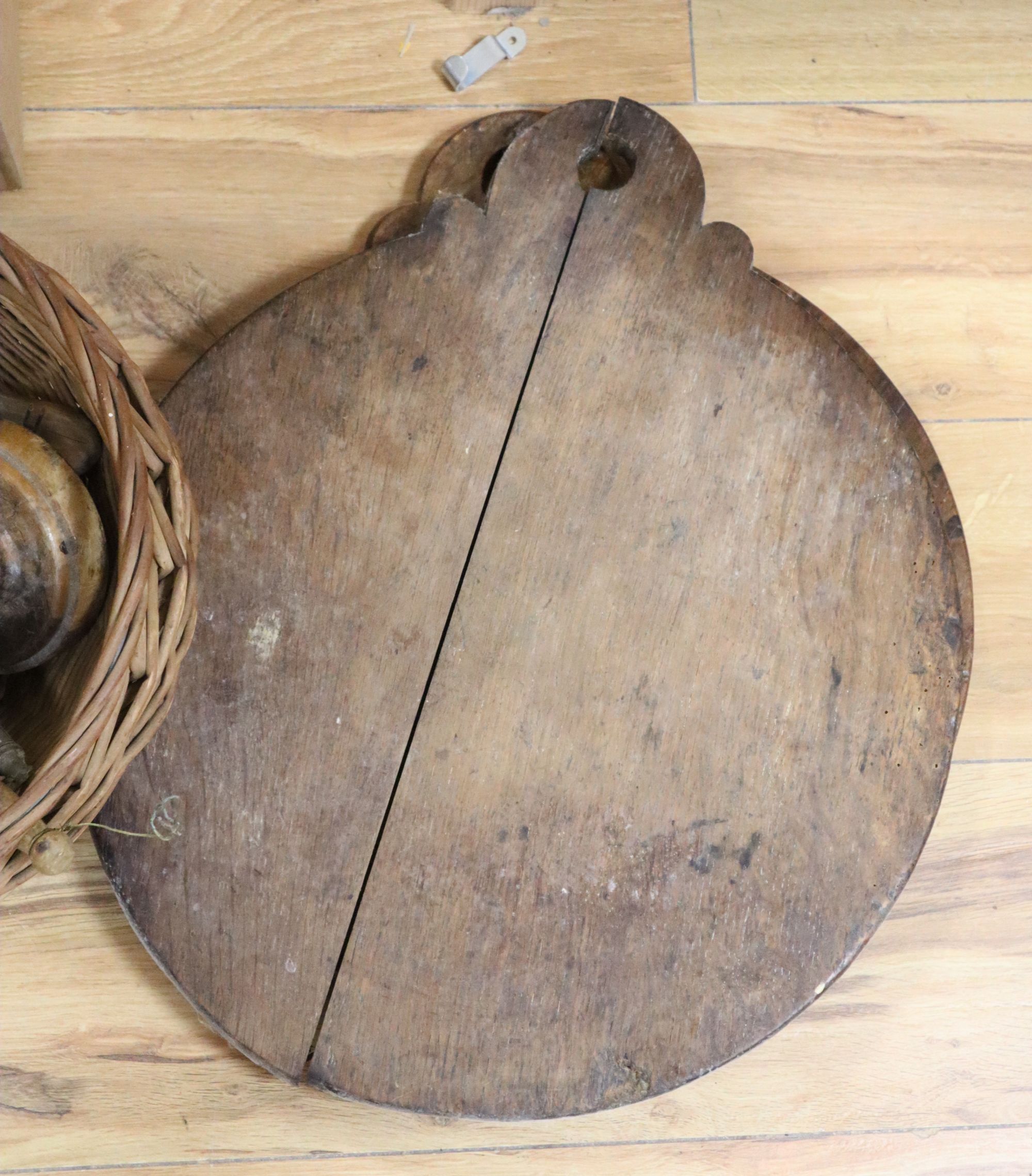 A large quantity of 19th/20th century treen, including an elm candlebox, bread boards, a child's chair, spoons etc.